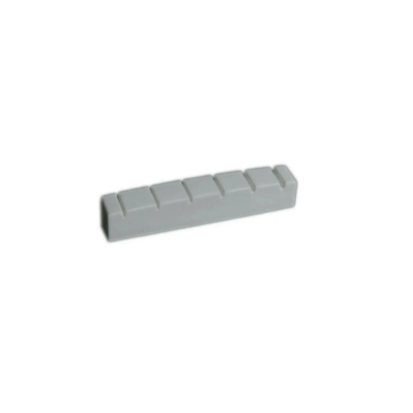 Guitar nut replacement part for electric or acoustic guitars on white background
